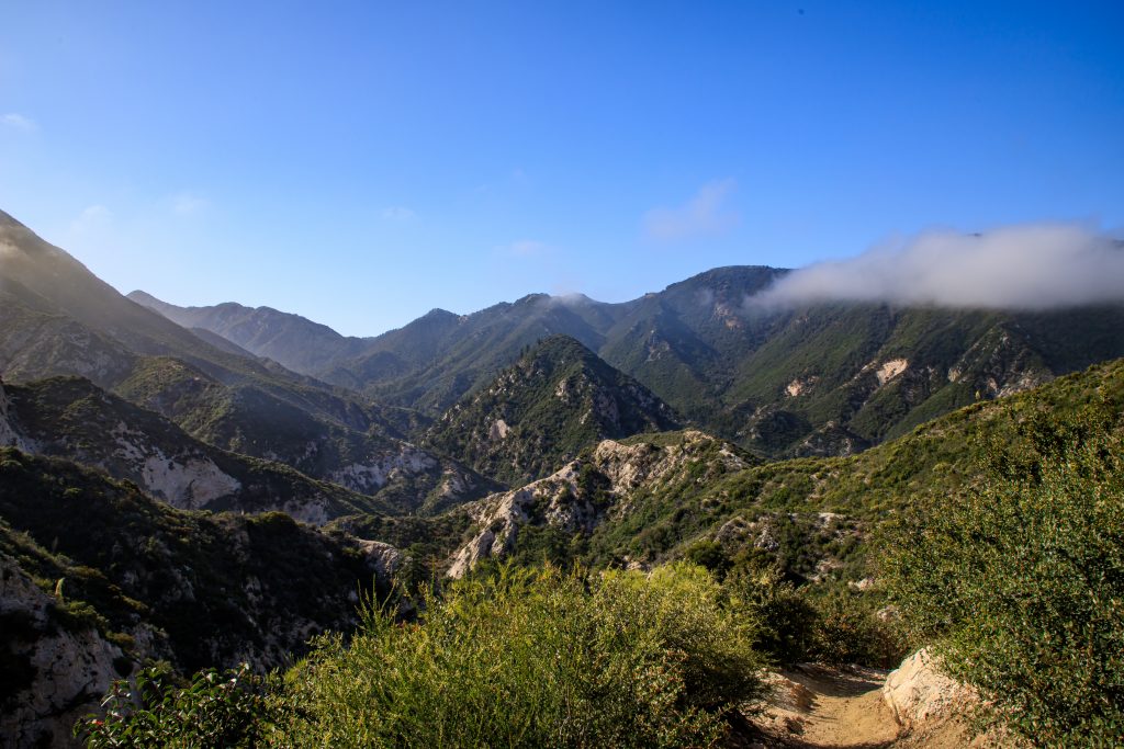 Clouds breaking above mountains