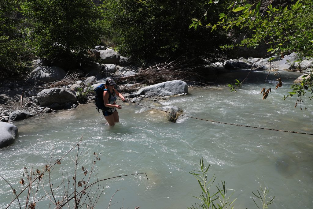 River crossing with a rope for assistance. 