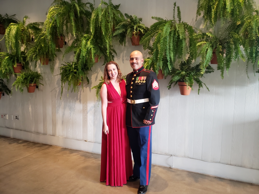 Couple in front of a fern wall at The MODERN Honolulu in Hawaii at a USMC Ball