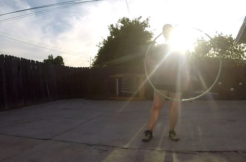 Silhouette of a girl hula hooping