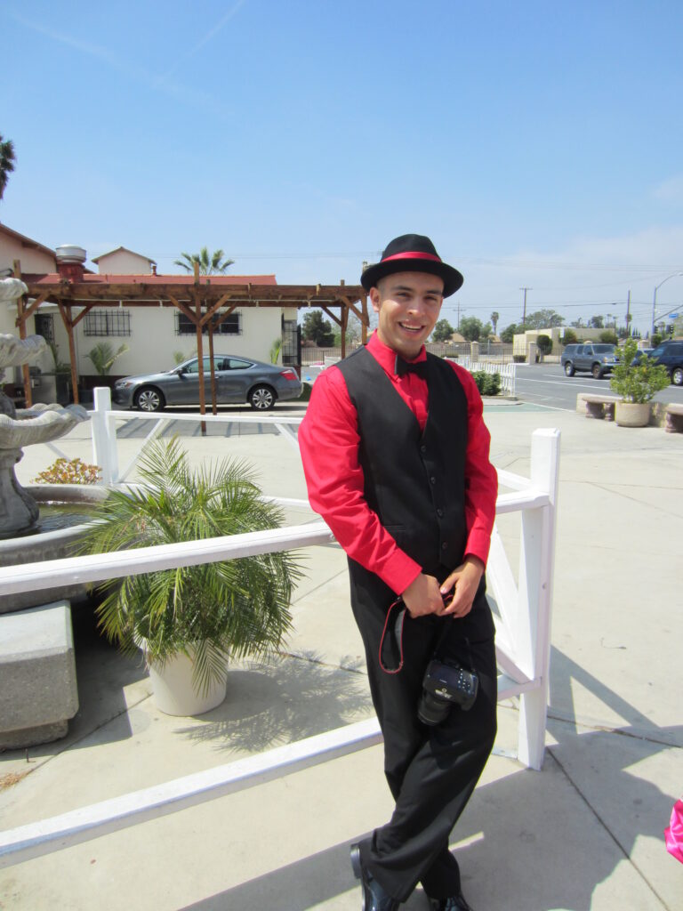 Boy in a red and black suit