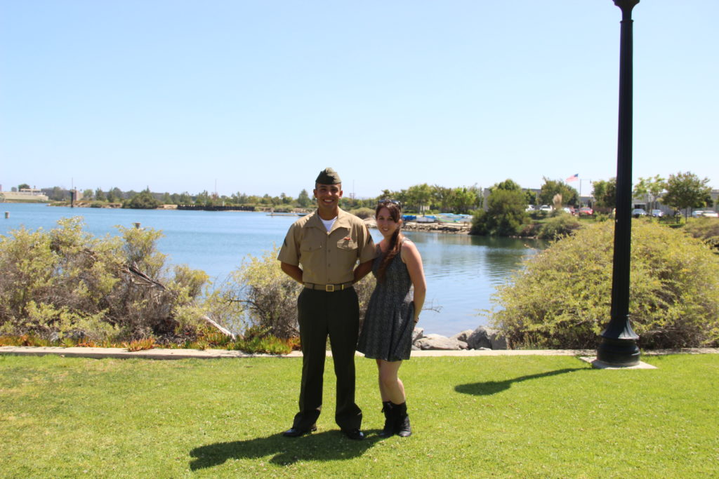 Marine and girl in front of a lake