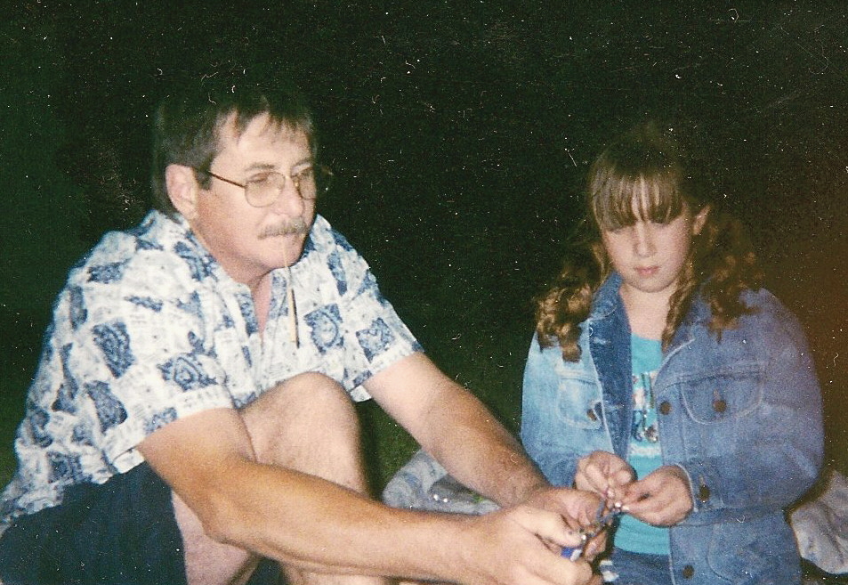 Dad and daughter toast marshmallows 
