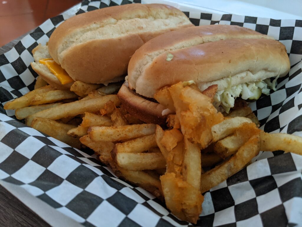 Chicken sandwich on a roll with fries